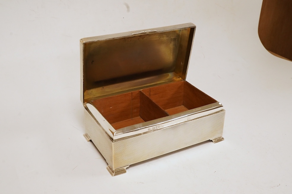 A George V engine turned silver mounted rectangular cigarette box, by Colen Hewer Cheshire, Chester, 1924, 16.6cm. Condition - poor to fair